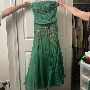 Long Beautiful dress with covered slits and pretty Jewel design all around.